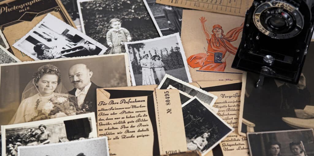 Genealogy and family history photos and files on a desk