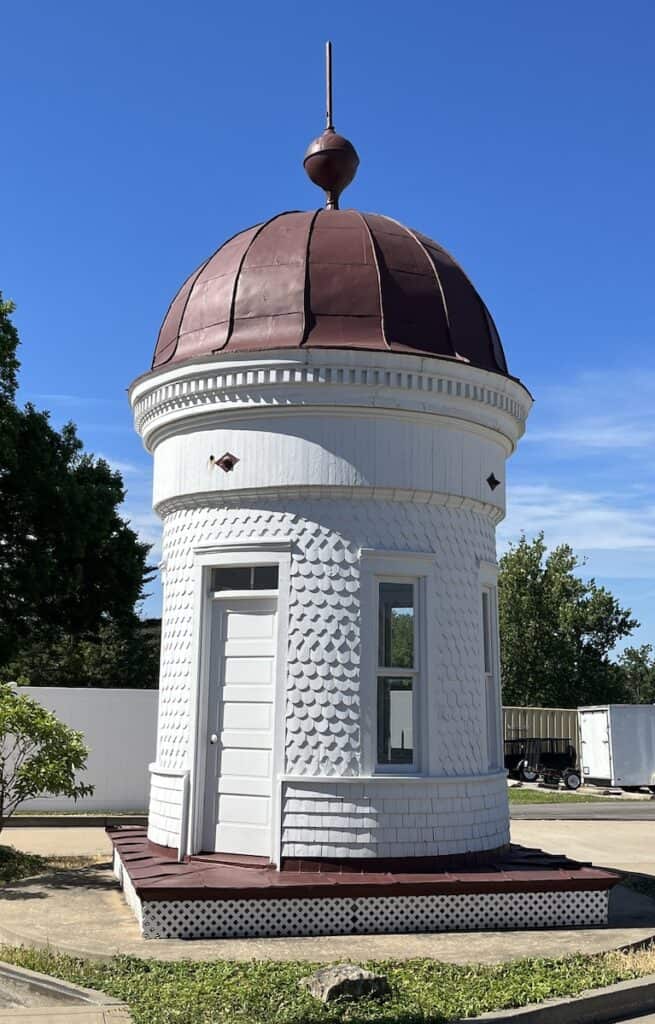 Original copula of Warren County Courthouse sitting outdoors under a crisp blue sky.