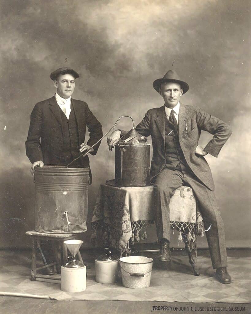 Two men pose with a still in this file photo