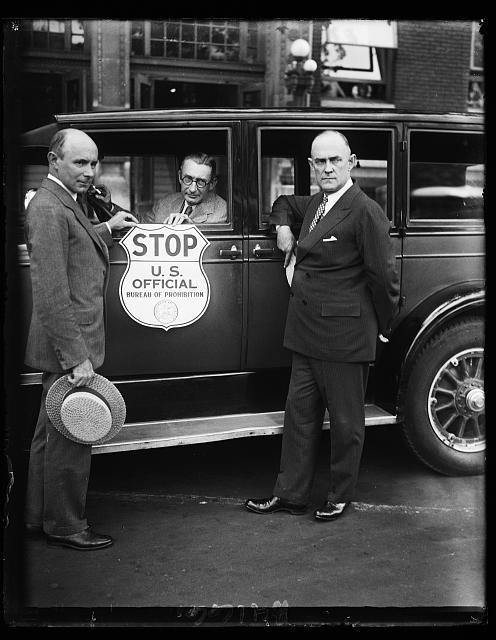 Stop when you see this sign. This is the new insignia plate the Bureau of Prohibition has adopted for use by prohibition agents in stopping suspected automobiles.