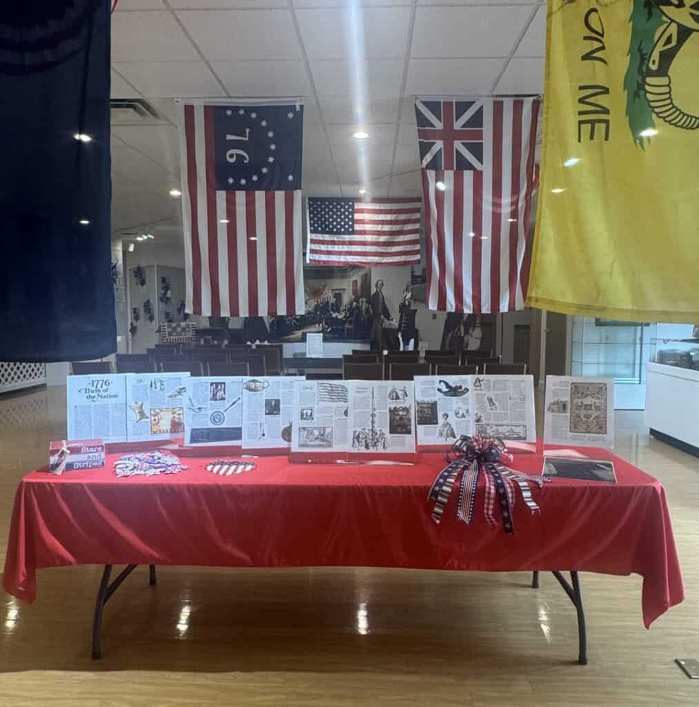 Warren County Historical Society display with American flags and historical documents.