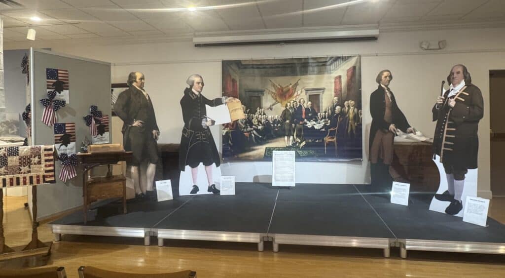 Historical reenactment display with figures in colonial attire at Warren County Historical Society.